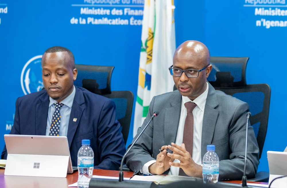 Minister of Finance and Economic Planning Yusuf Murangwa addresses journalists as RSSB Chief Executive officer Regis Rugemanshuro looks on on December 2, 2024. Craish Bahizi