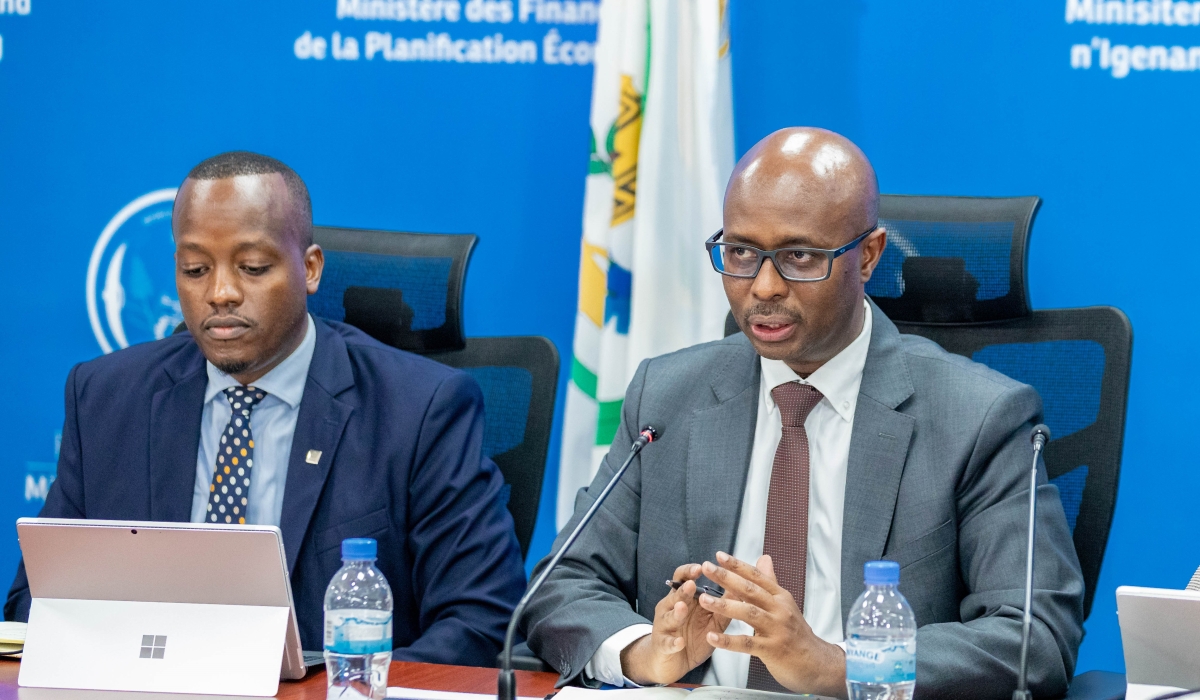 Minister of Finance and Economic Planning Yusuf Murangwa addresses journalists as RSSB Chief Executive officer Regis Rugemanshuro looks on on December 2, 2024. Craish Bahizi