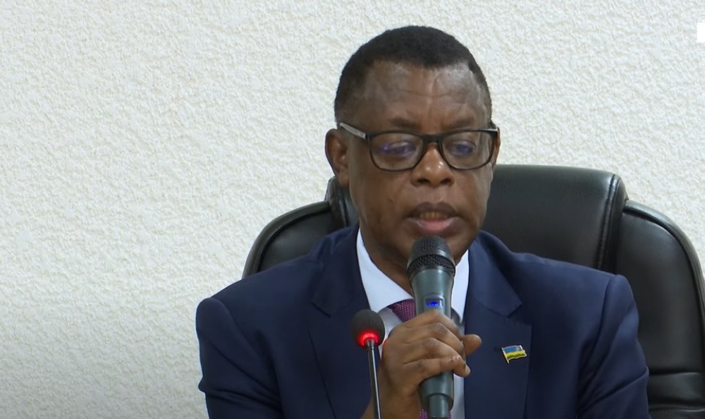 Gen.(Rtd.) James Kabarebe, Minister of State for Regional Cooperation at the Ministry of Foreign Affairs addresses members during a meeting with Rwandan political parties  in Kigali on Tuesday, February 25. Courtesy