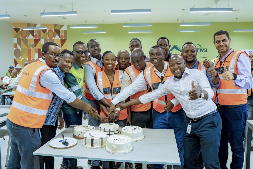BRALIRWA Plc staff cut a cake during the celebration of the Bronze certification, that the company was awarded