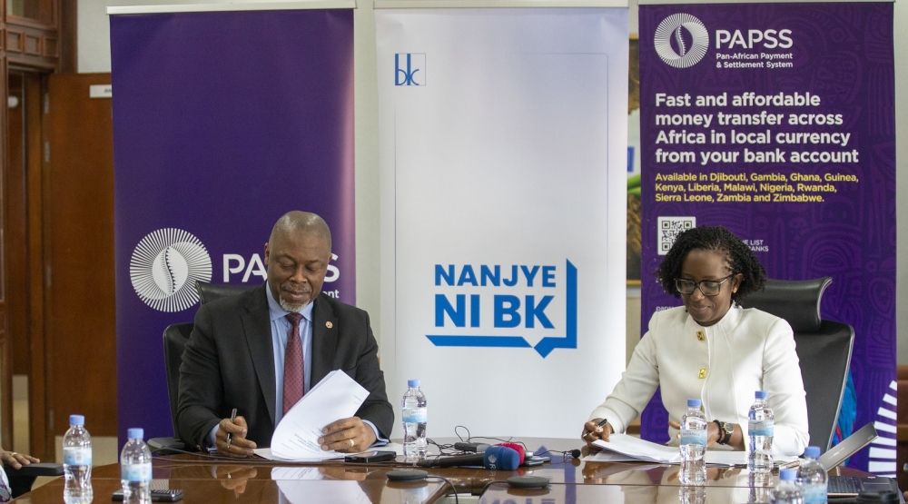 Bank of Kigali CEO Diane Karusisi and The Chief Executive of PAPSS, Mike Ogbalu, sign the agreement in Kigali on Wednesday, February 26. Photos by Craish Bahizi