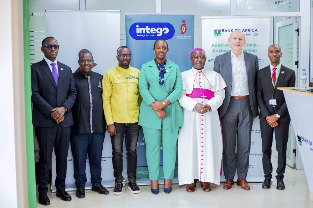 Officials pose for a group photo at the launch of a new saving account Intego in Muhanga.