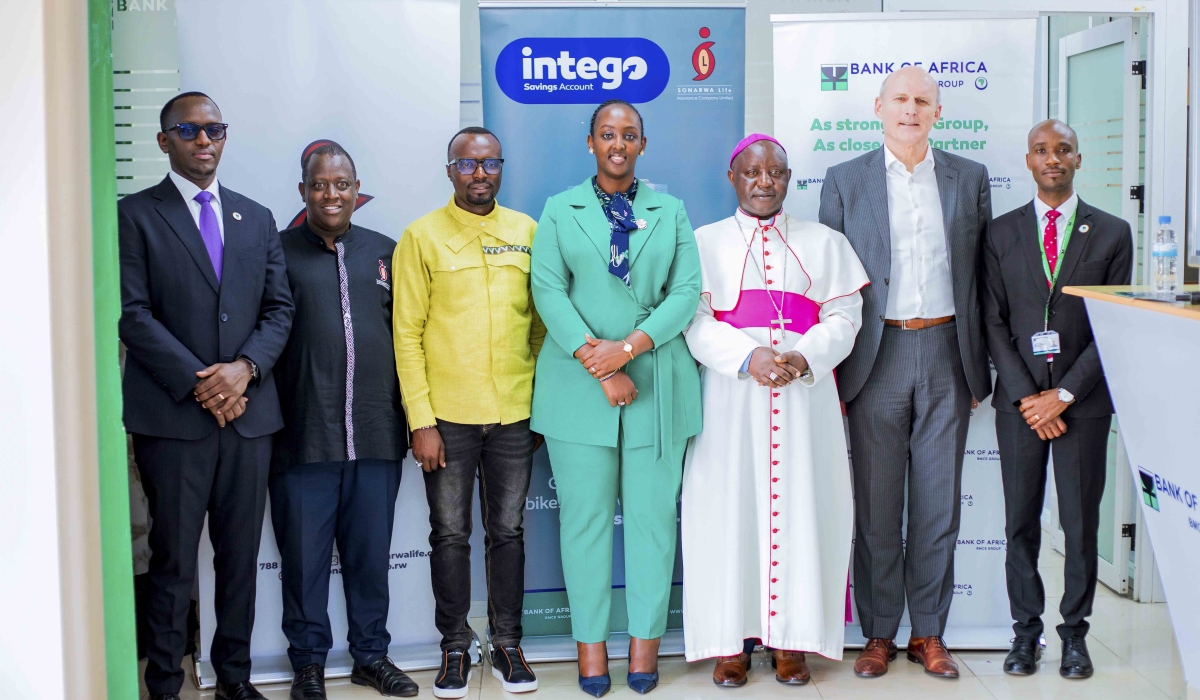Officials pose for a group photo at the launch of a new saving account Intego in Muhanga.