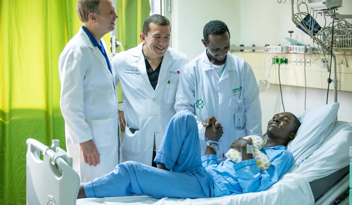 Dr. Maurice Musoni, Rwanda&#039;s first cardiothoracic surgeon and other medics interact with a patient at King Faical Hospital on February 13, 2020. Photo by Craish Bahizi