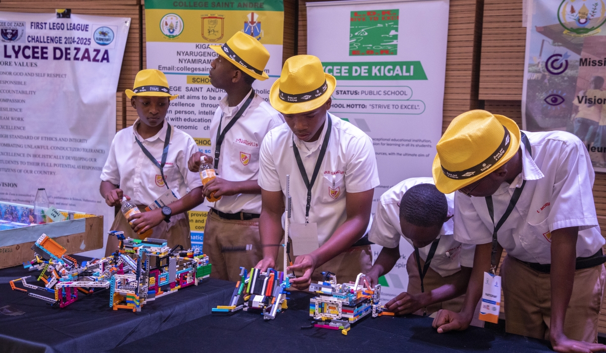 A  secondary student showcases their AI project during the grand finale of the First Lego League competition in Kigali,