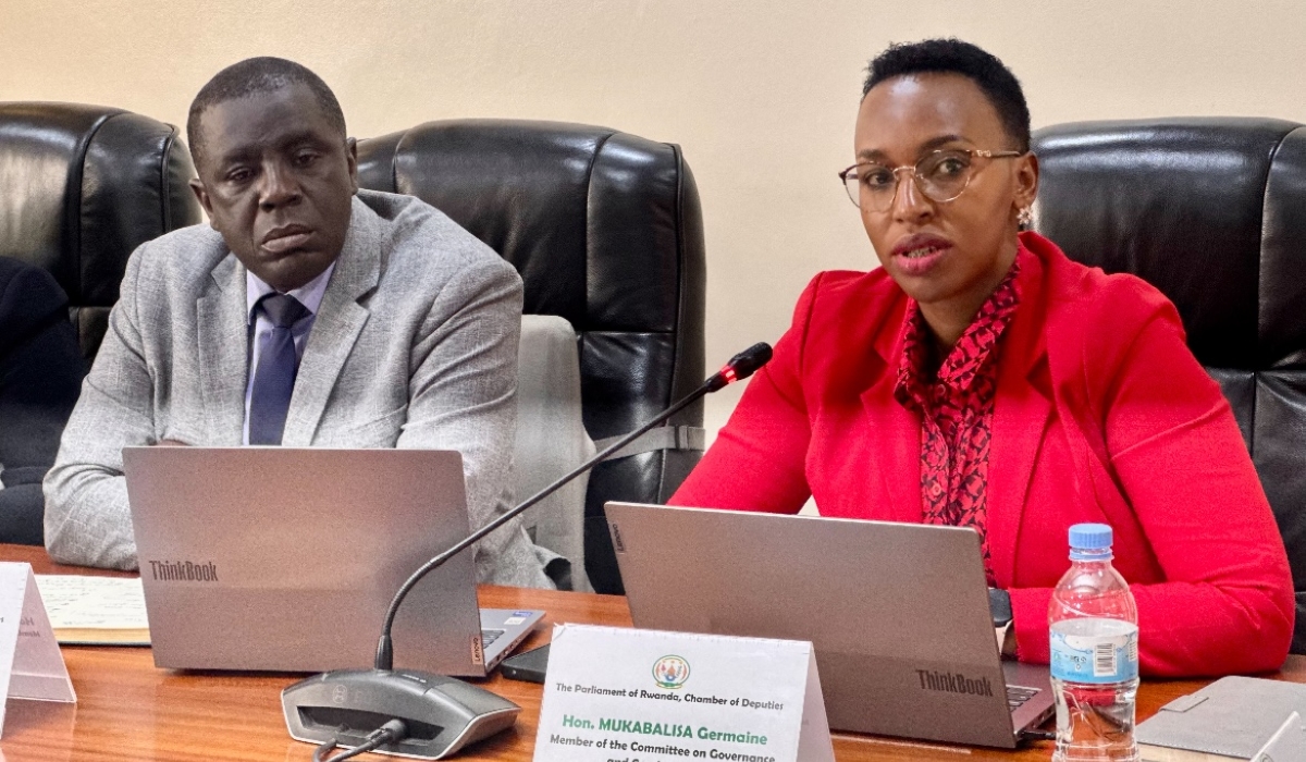 MP Germaine Mukabalisa (R) makes a point during the session on Wednesday, March 12, 2025, as MP Etienne Nsabimana Mvano listens (Emmanuel Ntirenganya)
