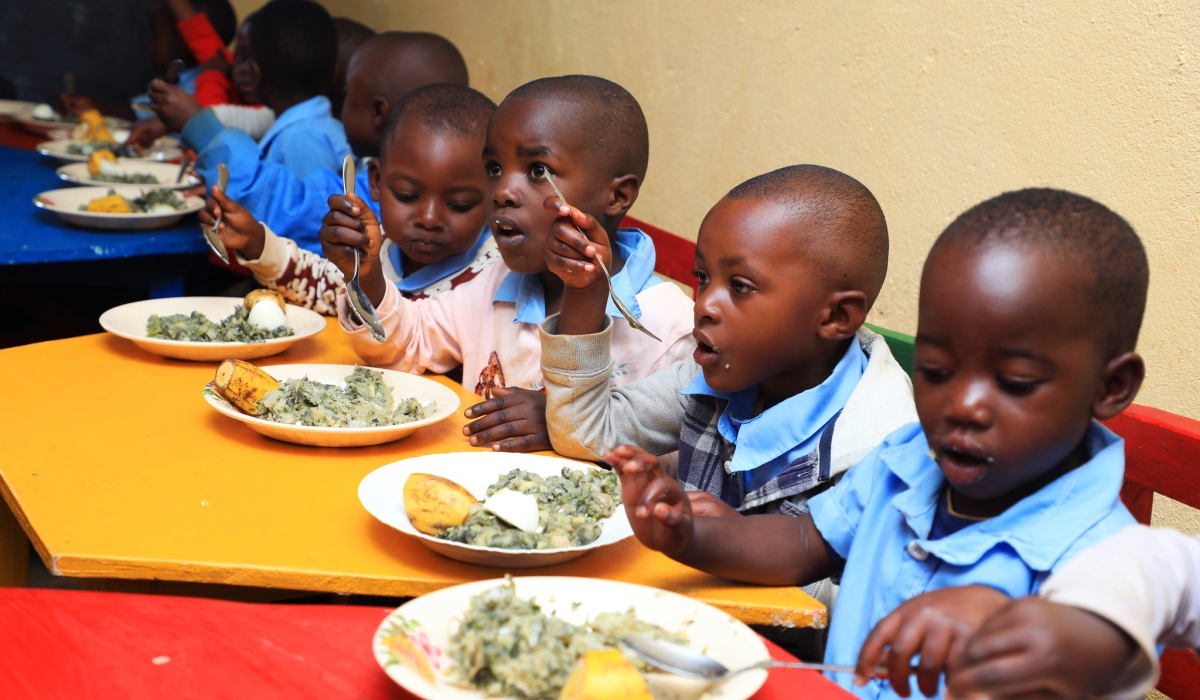 Children eat nutritious food at ECDC in Nyamasheke District through “GIKURIRO KURI BOSE” program. Photo by Craish Bahizi