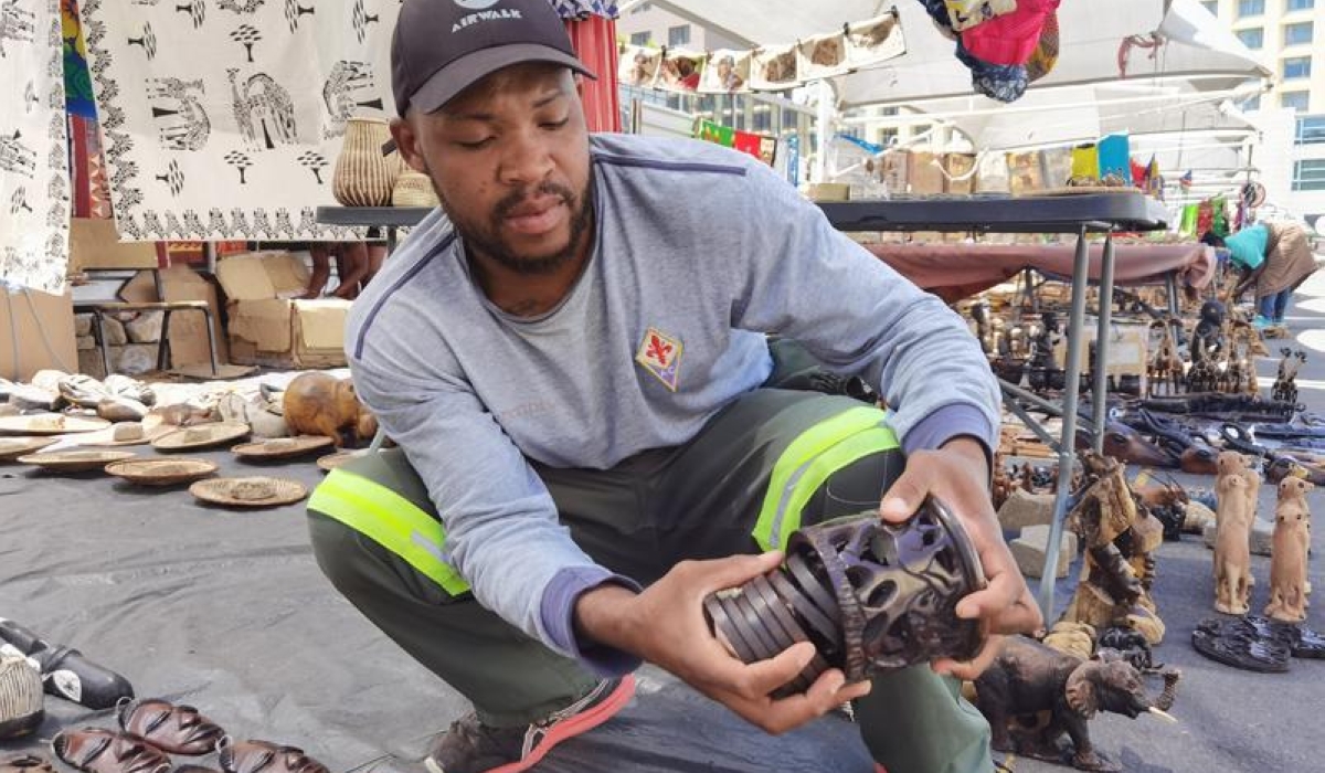 An artist shows an artwork at a street art market in Windhoek, Namibia, on March 8, 2025. Street markets in Windhoek, Namibia&#039;s capital, are fueling a significant boom in the creative industry amid limited commercialization opportunities for local artists. (Photo by Ndalimpinga Iita/Xinhua)