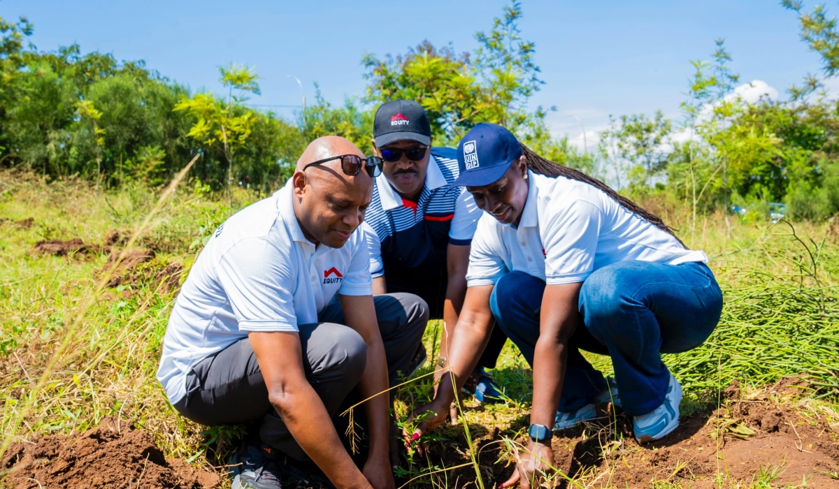 Equity Bank Rwanda MD Hannington Namara, UNDP Rwanda Representative Fatmata Sesay and Eastern Province Governor Pudence Rubingisa planting trees