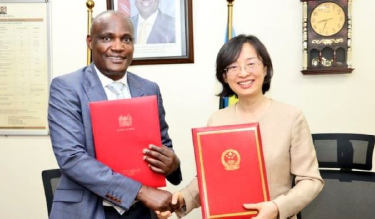 Kenya&#039;s Treasury Cabinet Secretary John Mbadi shakes hands with the Chinese Ambassador to Kenya, Guo Haiyan, after signing the grant agreement on March 27. Courtesy
