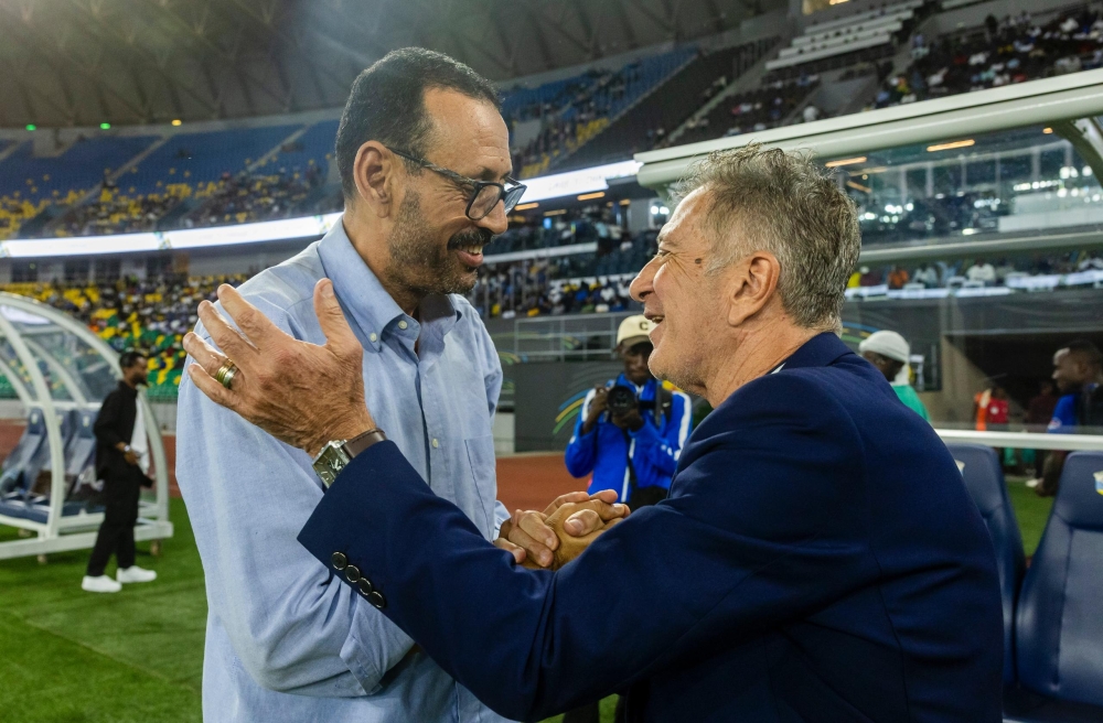 Mukura VS head coach Afahmia Lofti (L) and his Rayon rival coach Robertinho great each other before the match between the two teams on Saturday, March 29, at Amahoro Stadium- Photo by Olivier Mugwiza