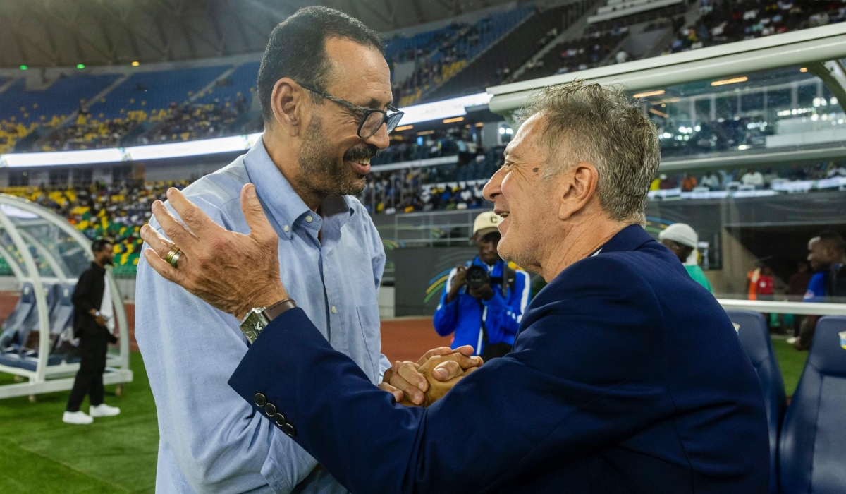 Mukura VS head coach Afahmia Lofti (L) and his Rayon rival coach Robertinho great each other before the match between the two teams on Saturday, March 29, at Amahoro Stadium- Photo by Olivier Mugwiza
