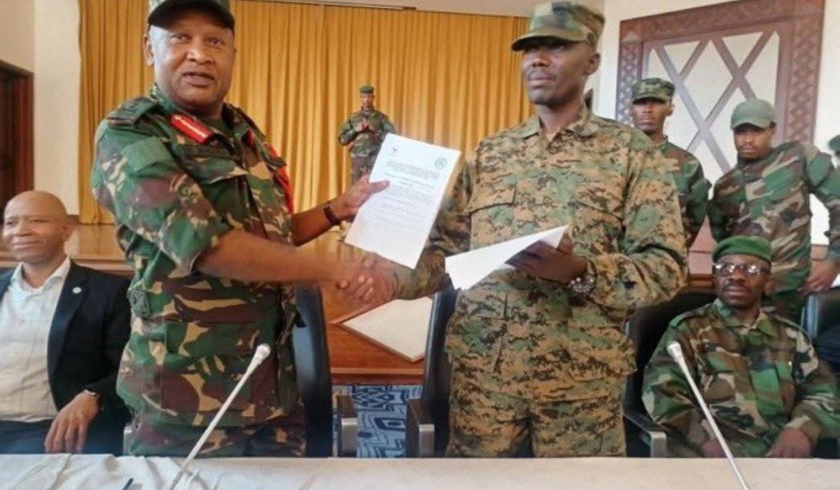 Tanzania’s Maj Gen Ibrahim Michael Mhona and Alliance fleuve Congo military commander Maj Gen Sultani Makenga sign the agreement on SADC troops’ withdraw, in Goma  on Friday, March 28