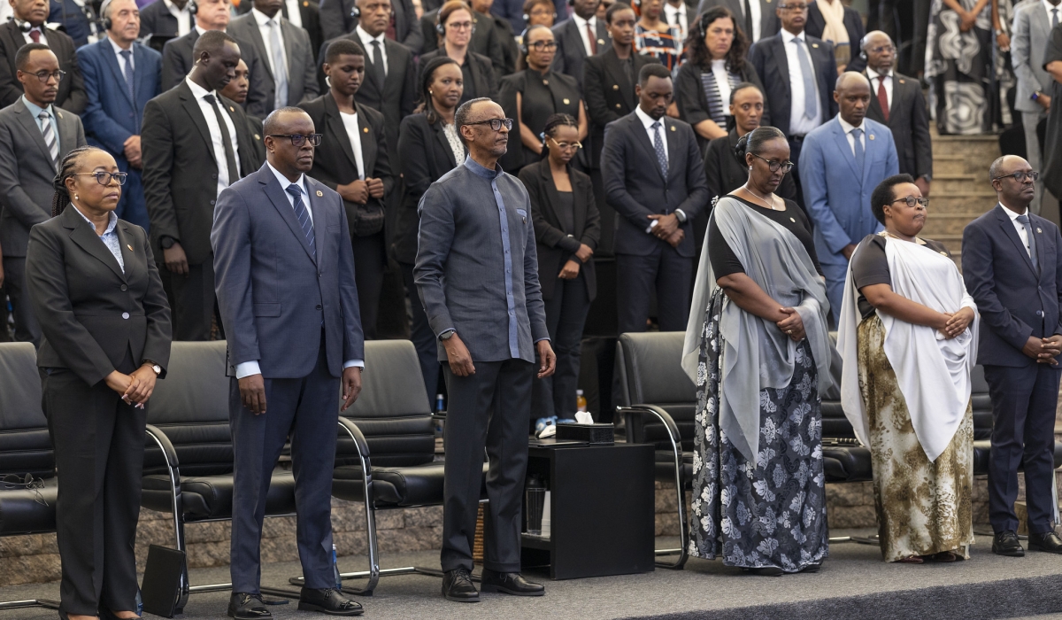President Paul Kagame and First Lady Jeannette Kagame and other mourners observe a moment of silence at the event  at Kigali Genocide Memorial on Monday, April 7.