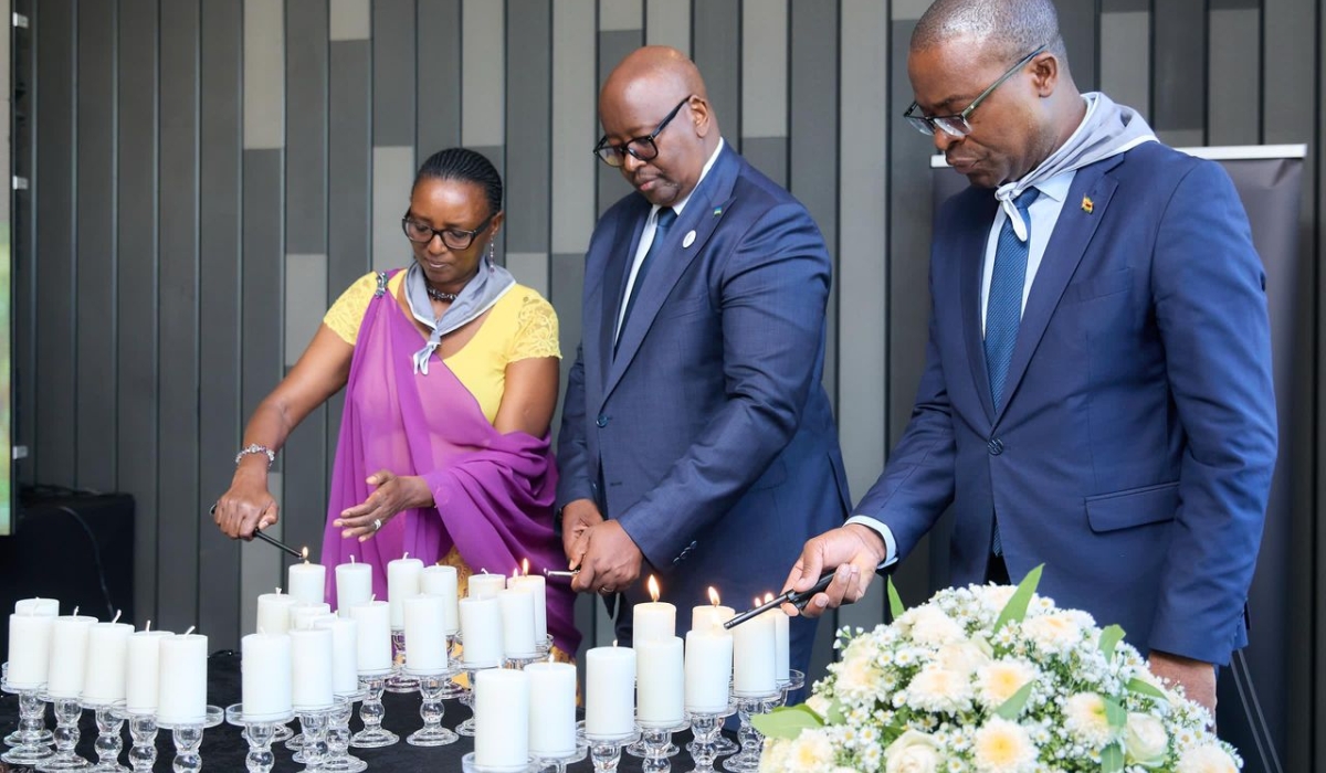 Ambassador James Musoni and Zimbabwe&#039;s Foreign Affairs and International Trade Minister Professor Amon Murirwa lit candles during the commemoration event in Zambia on Monday