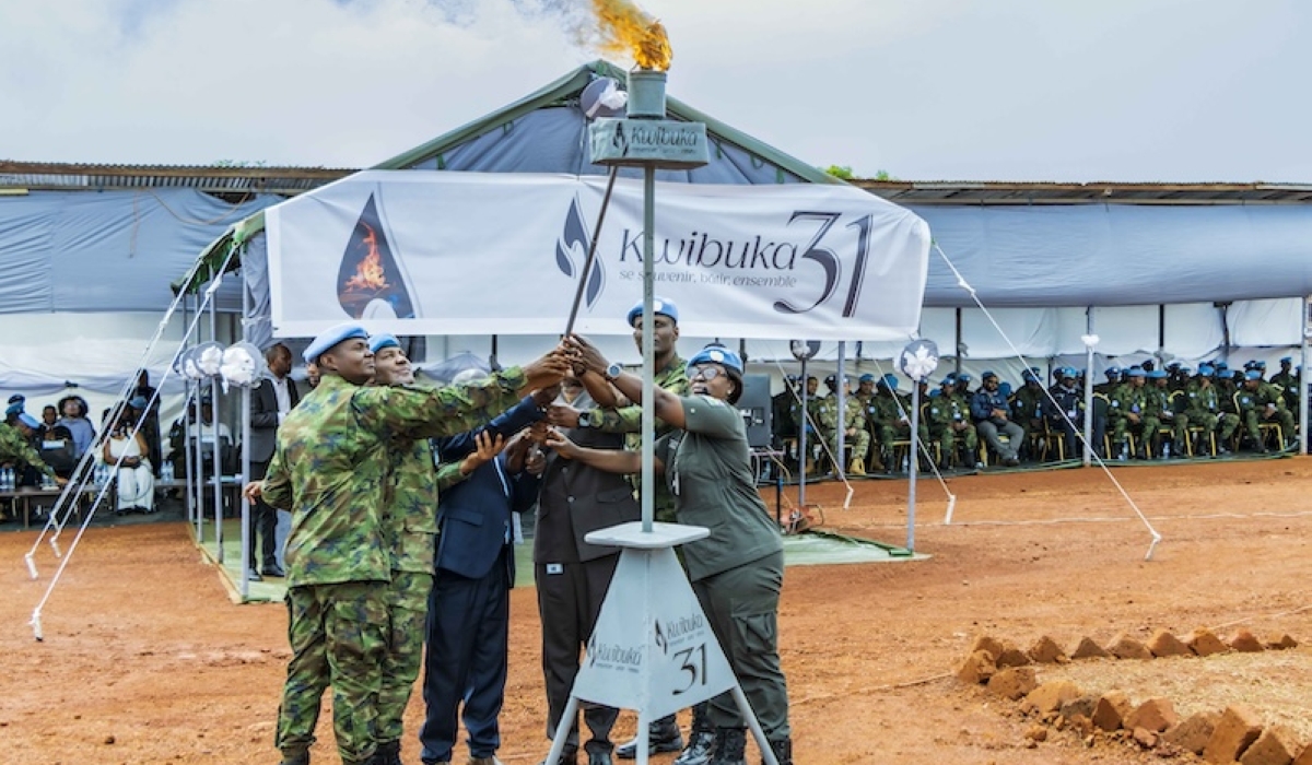 Attendees lighting the flame in remembrance of over one million lives lost during the 1994 Genocide against the Tutsi