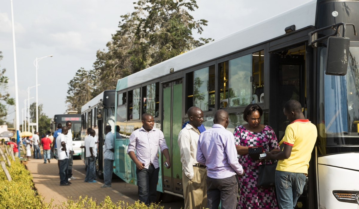Passengers board a public bus in Kigali. The City in its 2050 targets for public transport, aims to continue developing its transport infrastructure and services. Craish Bahizi