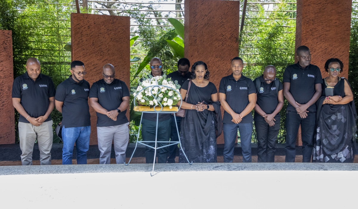 Staff from the East African Science and Technology Commission (EASTECO), observe a moment of silence  to pay tribute to the victims of the massacres at Kigali Genocide Memorial on Friday, April 11. Craish Bahizi