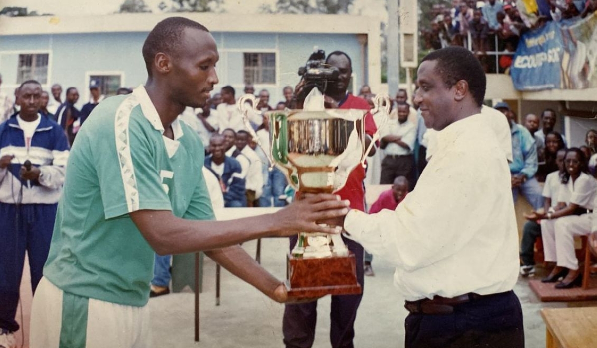 KVC&#039;s captain Alphonse Bayingana recieving the National volleyball trophy of 1998-1999 season-courtesy