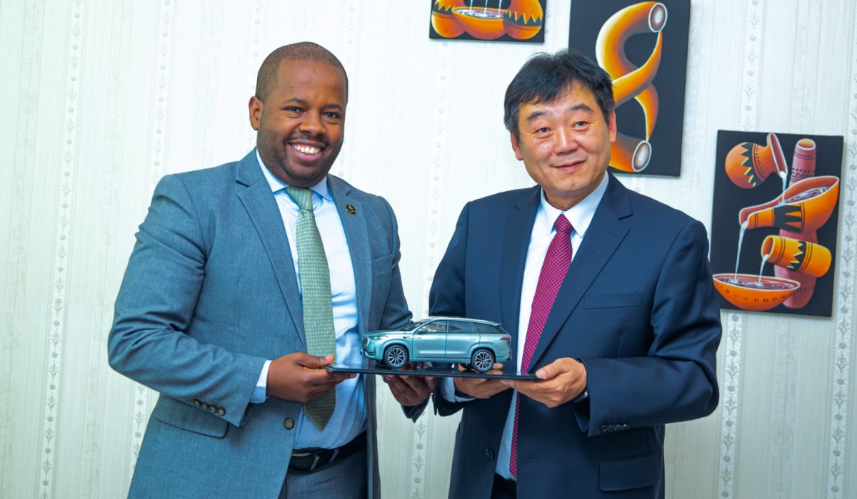 Kigali City Mayor Samuel Dusengiyumva and Chery Holding Group Chairperson Xu Hui pose for a photo after discussions with a delegation from the Chinese automotive company. Courtesy Photo