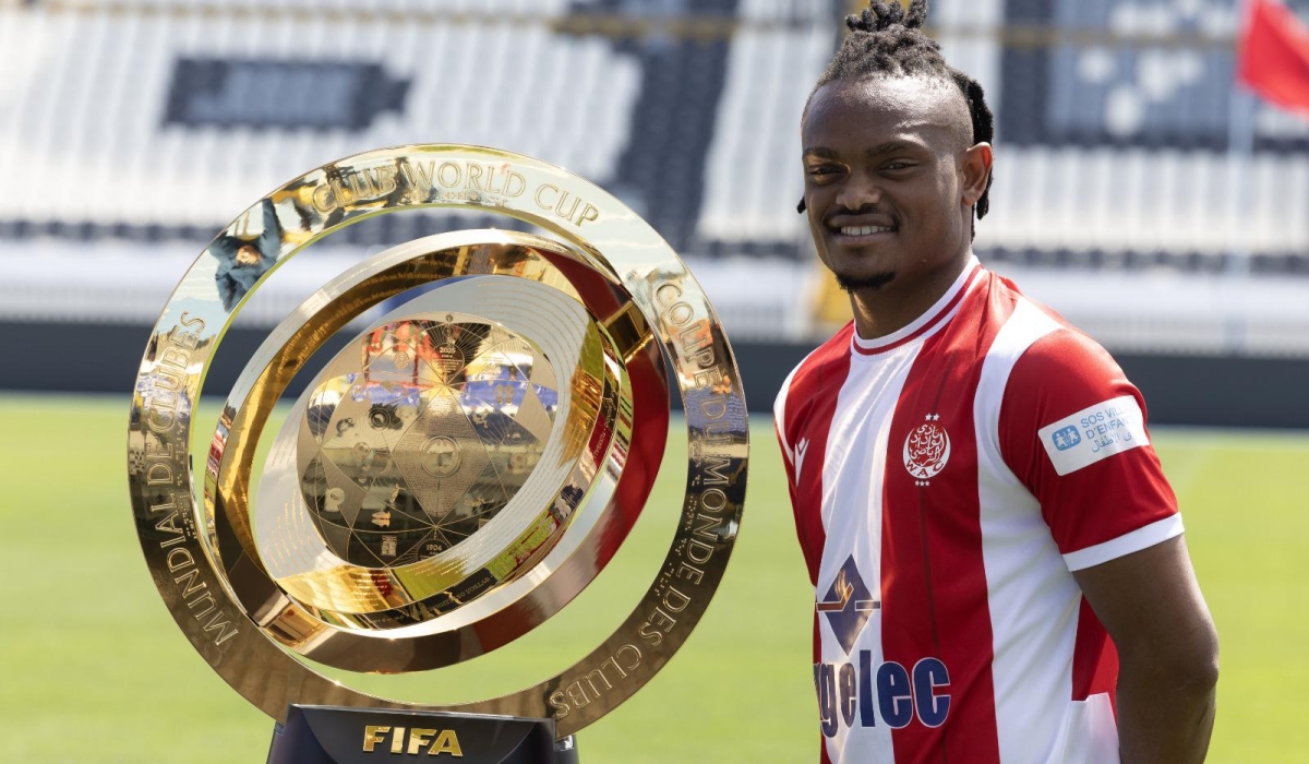 Tanzanian striker Selemani Mwalimu who plays for Wydad Athletic poses with the FIFA Club World Cup trophy when its tour reached in Casablanca in Morocco earlier this week-courtesy 
