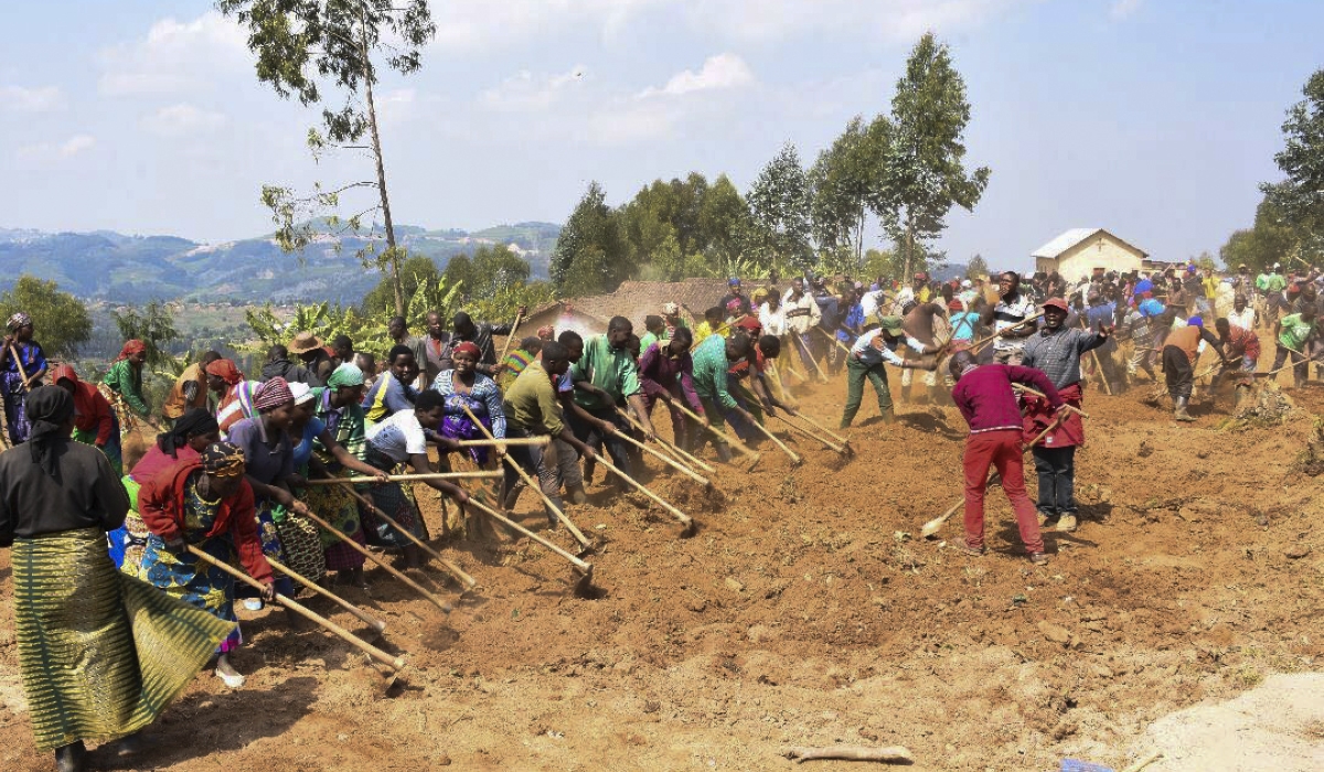 Residents work at a road maintenance project in Vision 2020 Umurenge Programme (VUP),. The minimum daily wage for VUP beneficiaries ranges between Rwf1000 and Rwf2500 depending on a district&#039;s standard of living.