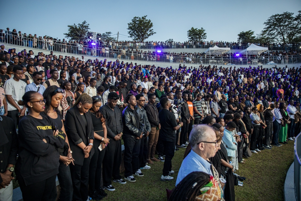 Thousands of youth observe a moment of silence during a commemoration event known as Our Past at Nyanza-Kicukiro Genocide Memorial. Dan Gatsinzi