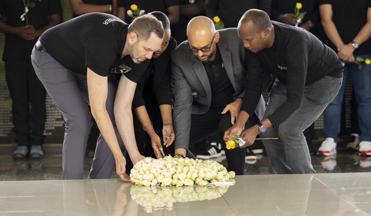 Staff members of QA Venue Solutions, a company that manages BK Arena, Zaria Courts, and Nyandungu Eco-Tourism lay a wreath to pay tribute to victims at Ntarama Genocide Memorial Park, on April 23. Courtesy