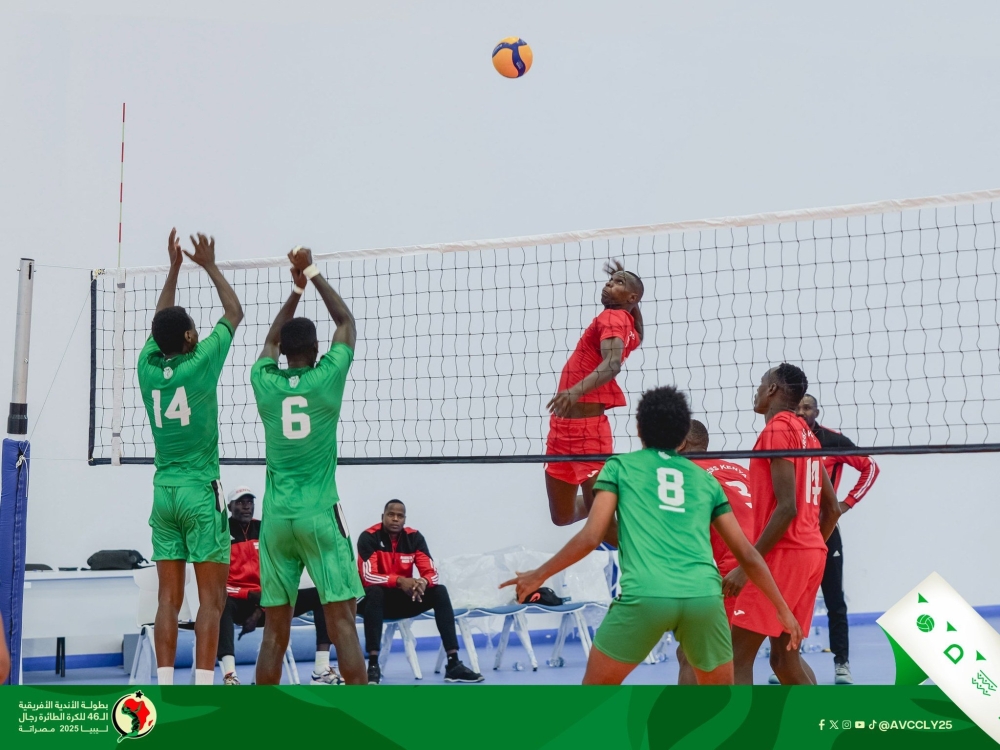 Kepler VC players attempt to block a shot by their Kenya Prison counterparts during the game.