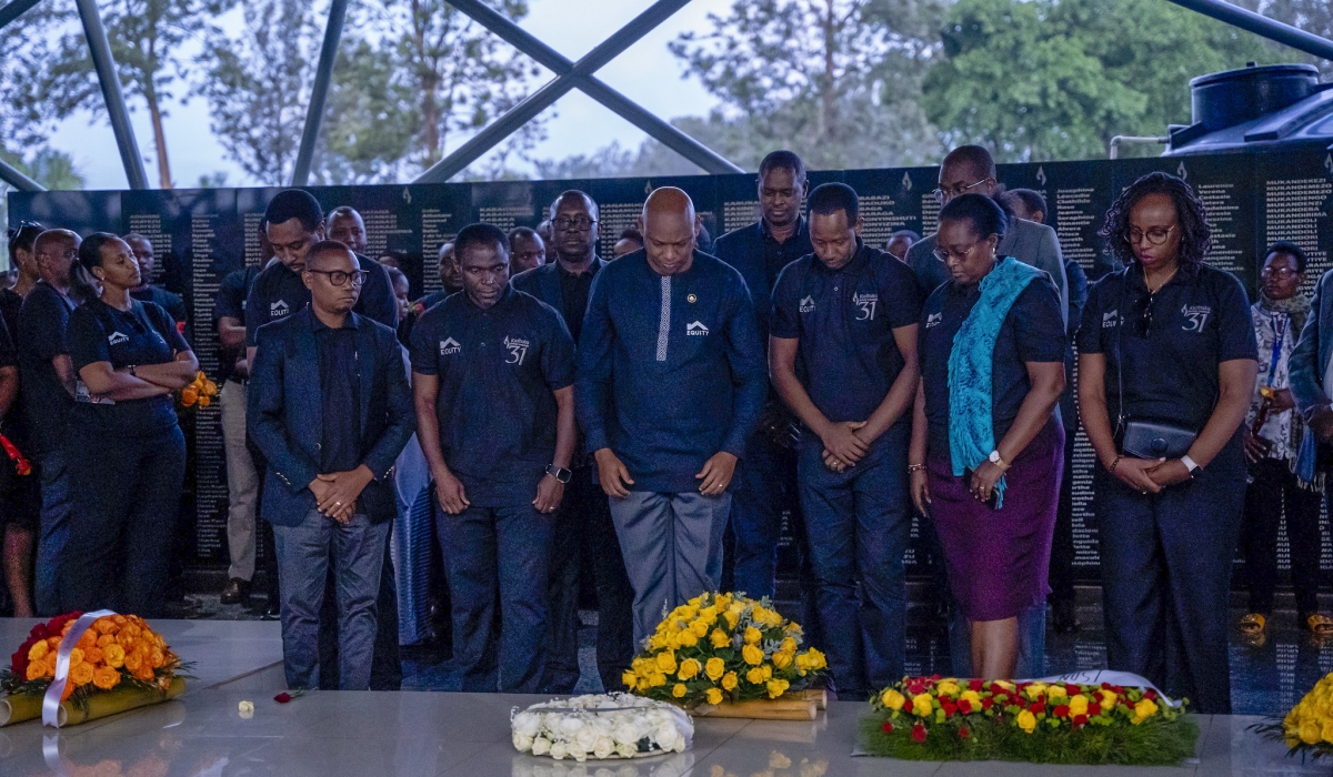 Equity Bank management ans stafff observe a moment of silence during a commemoration event at Ntarama Genocide Memorial , on Friday, April 25. Photos Kellya Keza