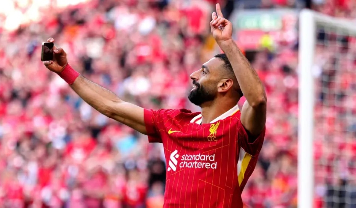 Mohamed Salah takes a selfie in front of the Kop after scoring in Liverpool&#039;s title-clinching win against Spurs at Anfield-PA Media