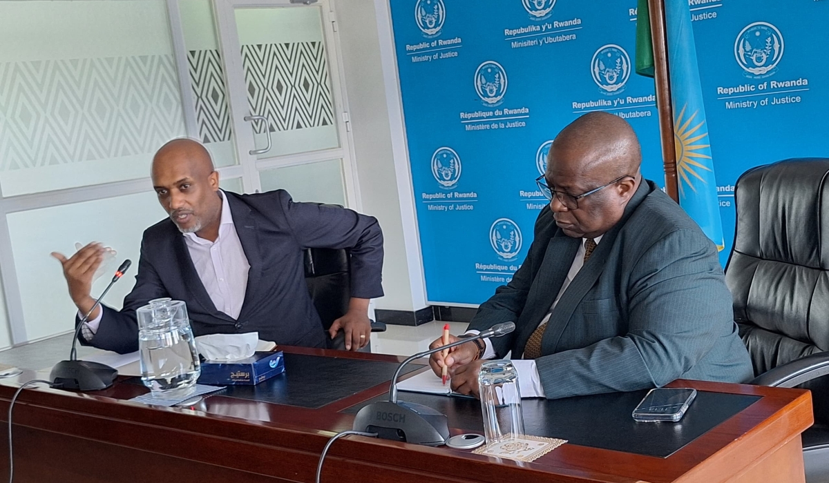 Minister of Justice Emmanuel Ugirashebuja and Namibia’s Deputy Chief Justice, Petrus T. Damaseb during a meeting in Kigali. Courtesy