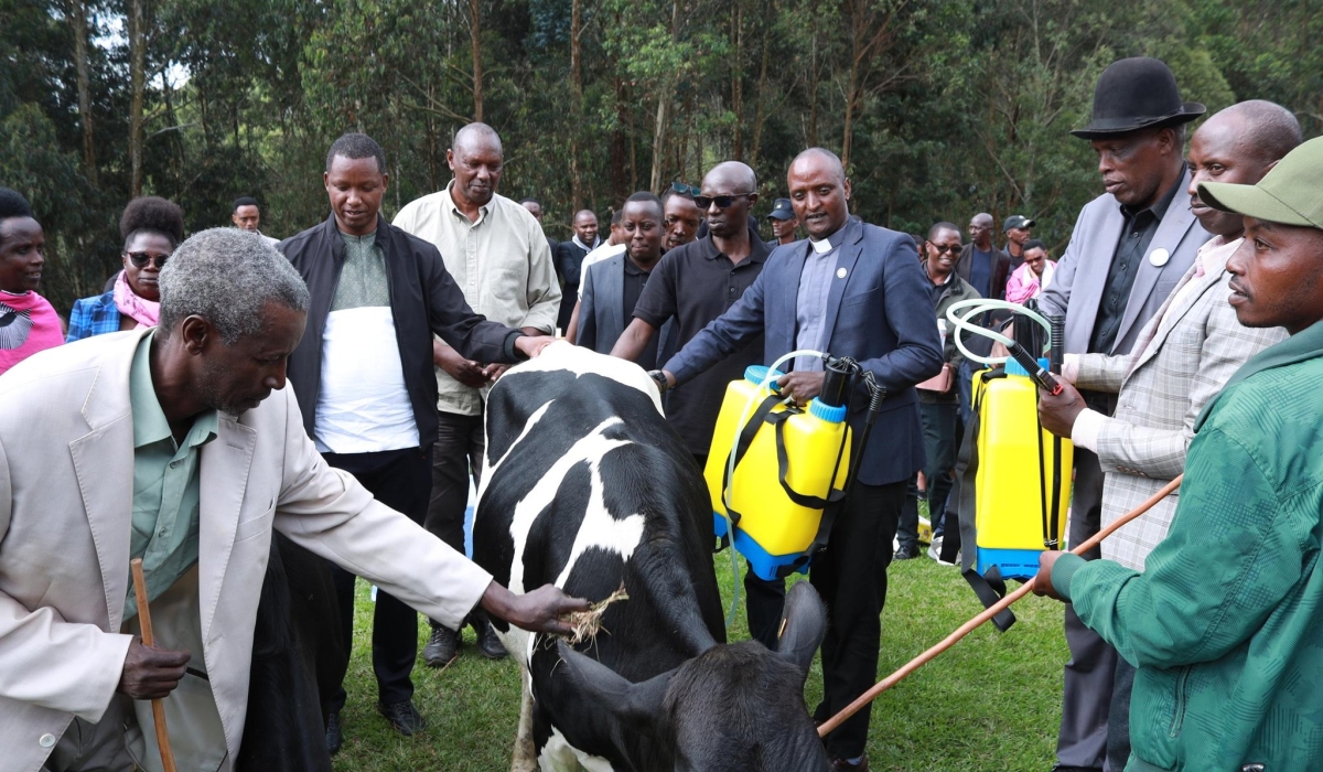 Residents of Nyarugunga Sector, Kicukiro District, donated cows and livestock care tools to two genocide survivors in Bisesero. Courtesy