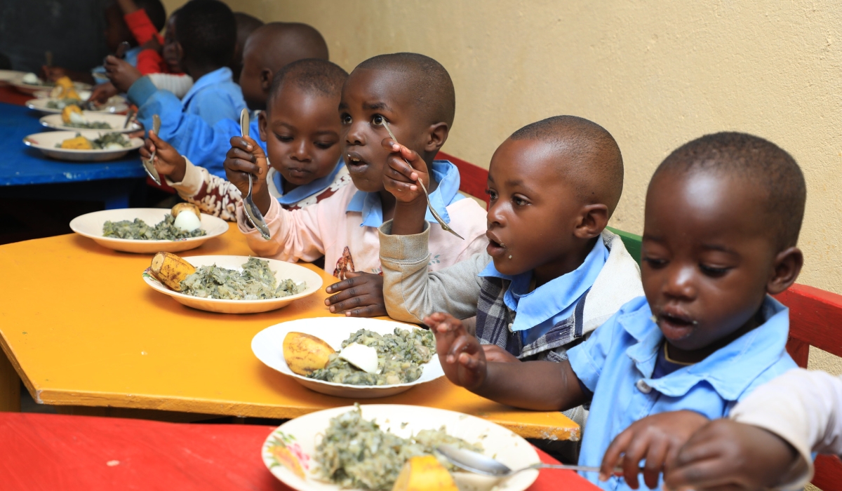 Children eat nutritious food during a programme to fight stunting in Nyamasheke. Photo  Craish Bahizi