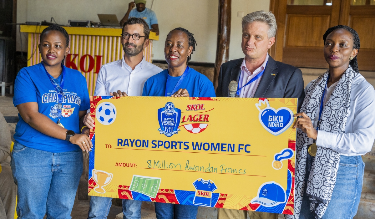 SKOL Brewery Ltd General Manager Eric Gilson hands over the cheque of Rwf 8 million to Rayon Sports Women FC management as a reward of their incredible 2024-25 season-Photos by Craish Bahizi