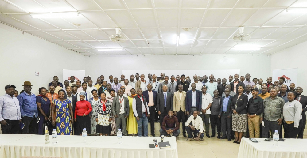 Farmers and officials pose for a group photo at the event in Rwamagana on May 24.