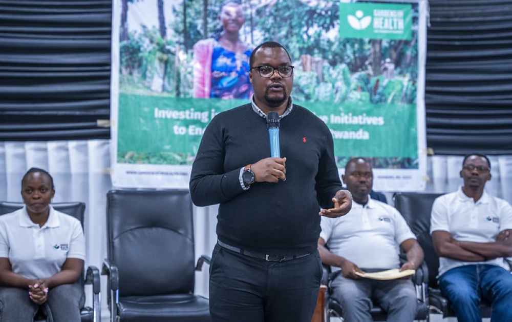 Jean Pierre Habaguhirwa, Division Manager in Burera District, addresses farmers at the event
