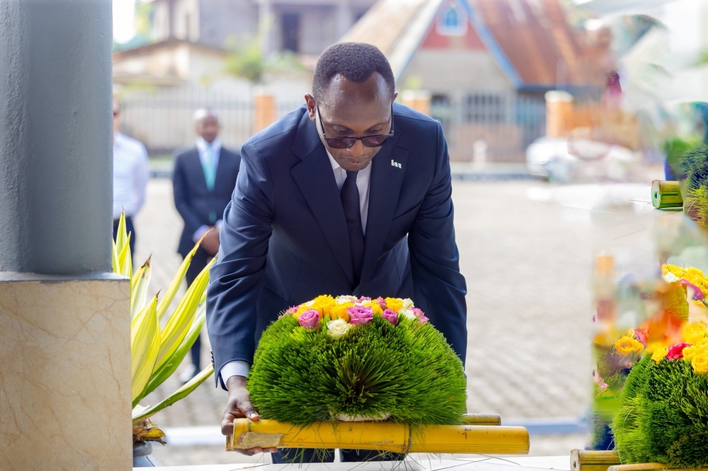 I&M Bank Chief Executive Officer Benjamin Mutimura lays a wreath to pay tribute to victims of the Genocide at Gisenyi Genocide Memorial. Courtesy
