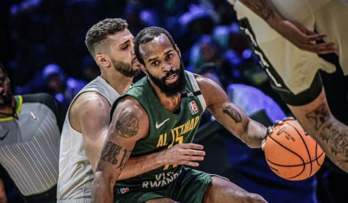 An Al Ittihad player (in green) dribbles past his Al Ahli counterpart during the game. Courtesy