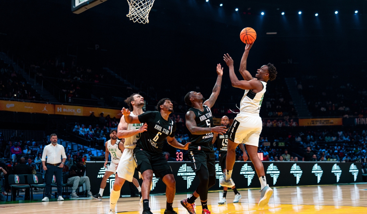 Al Ahli Tripoli&#039;s Caleb Agada rises high above Kriol Star players in an attempt to score.