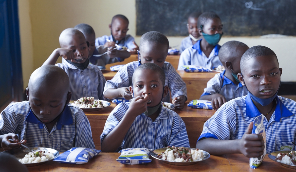 Students have lunch through schoolfeeding programme at Groupe Scolaire Ayabaraya in Kicukiro District   on Monday, February 28 . Photo by Craish Bahizi
