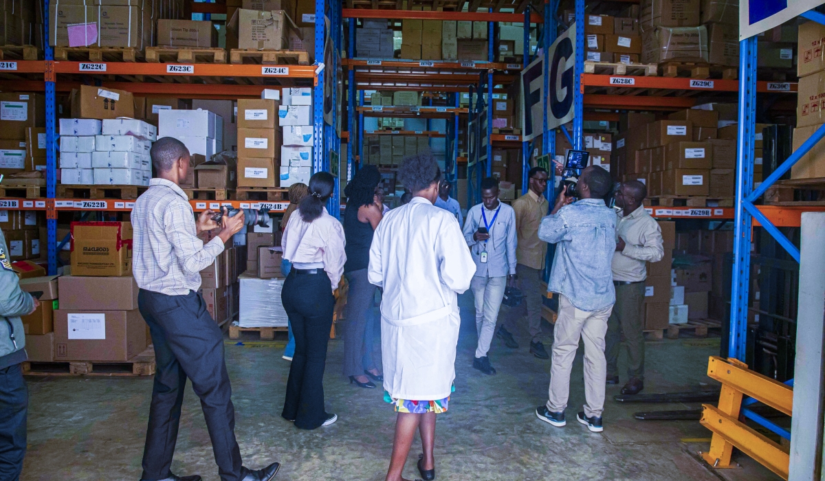 Journalists during a guided tour of one of the stores at Kacyiru. Photos by Kellya Keza