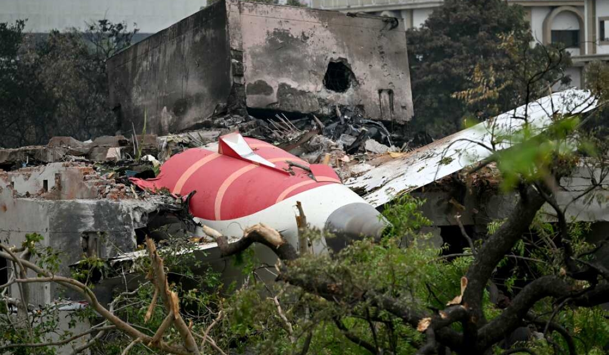 TOPSHOT - Debris of Air India flight 171 is pictured after it crashed in a residential area near the airport in Ahmedabad on June 13, 2025. Rescue teams with sniffer dogs combed the crash site on June 13 of a London-bound passenger jet which ploughed into a residential area of India's Ahmedabad city, killing at least 265 people on board and on the ground. (Photo by Punit PARANJPE / AFP) (Photo by PUNIT PARANJPE/AFP via Getty Images)