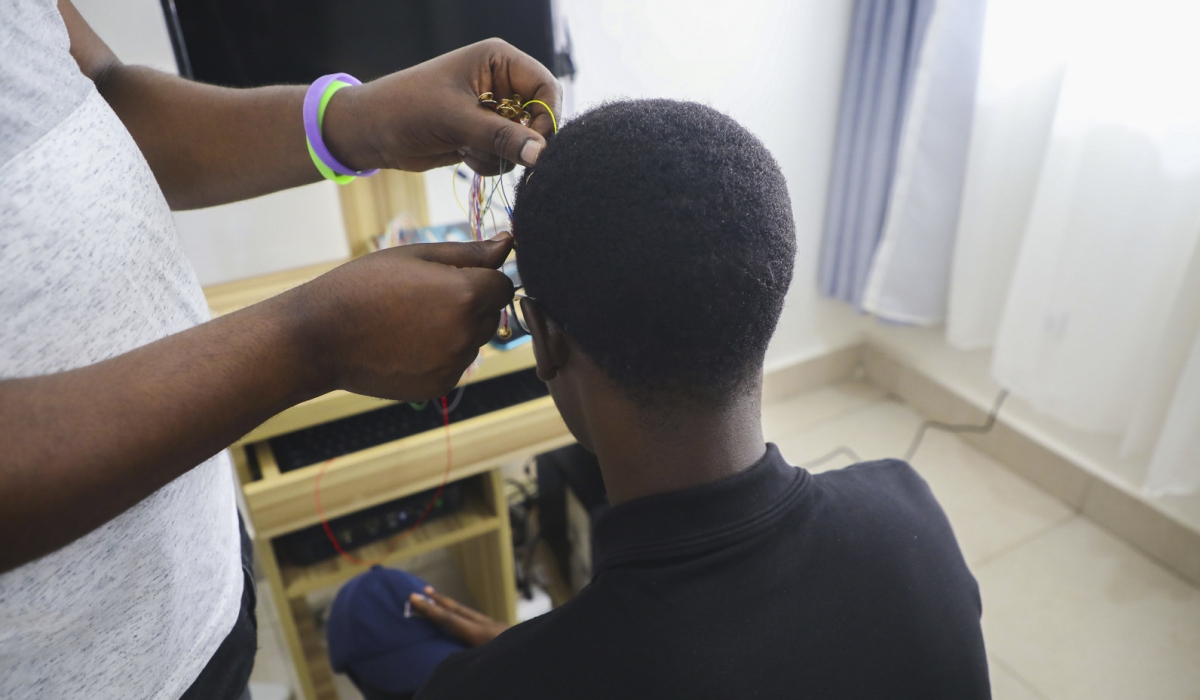 A medic tests a man at Kigali Referral Mental Health Centre. Craish Bahizi