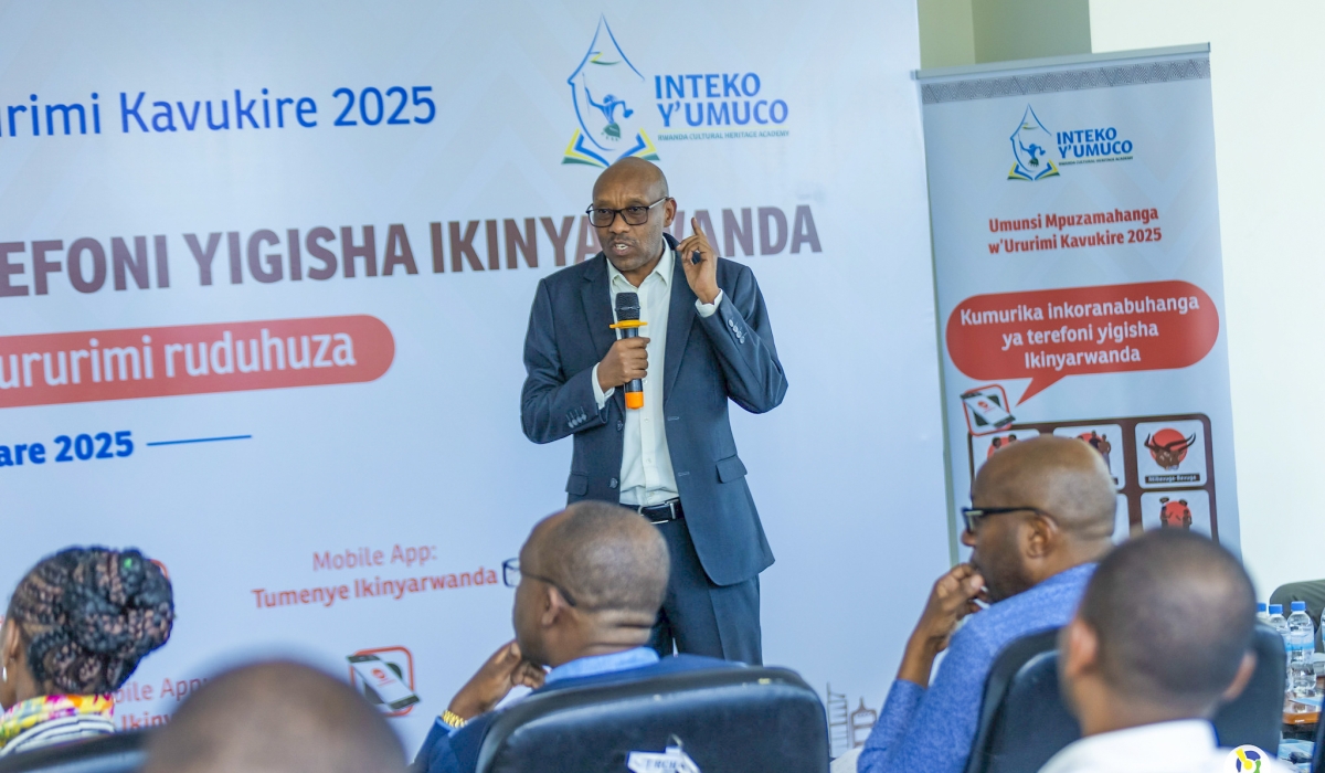 Participants follow a presentation during the celebration of the native language Kinyarwanda. Courtesy