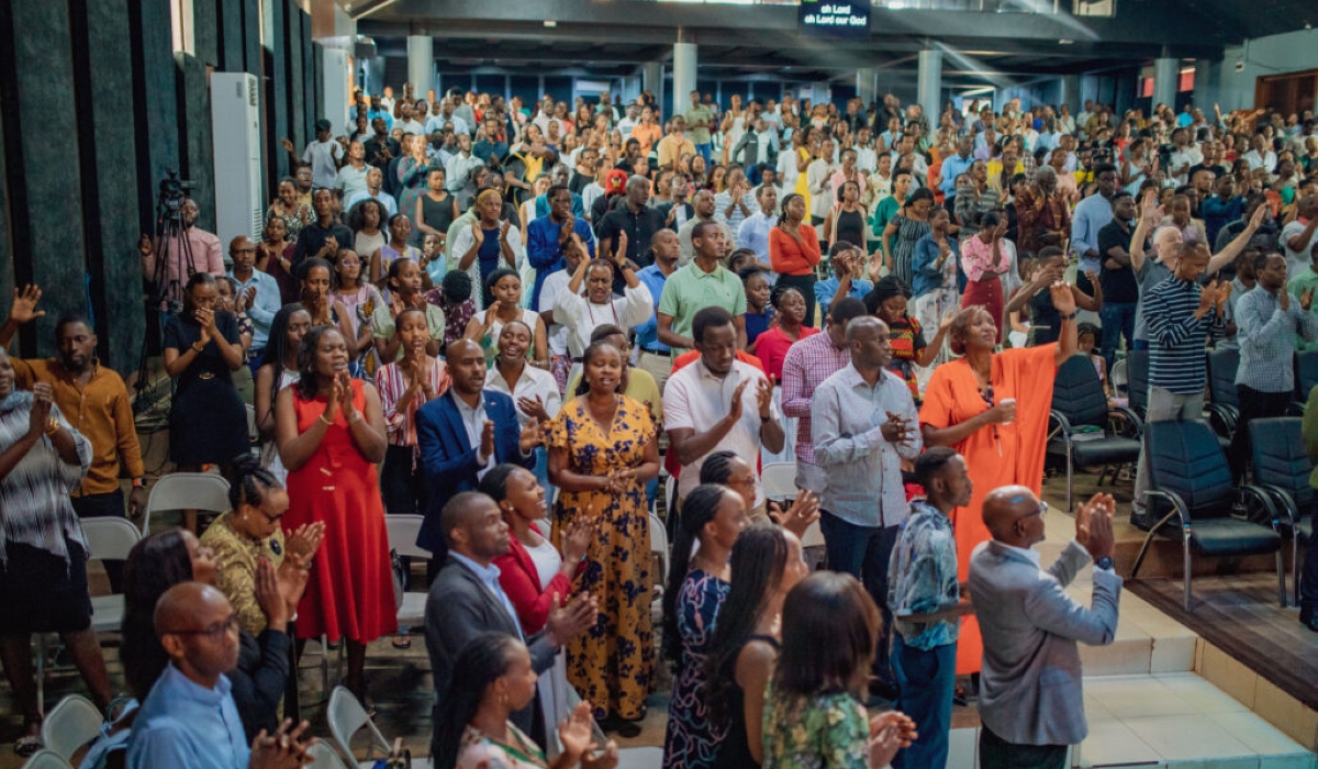 Worshippers in prayer at New Life Bible Church in Kigali
