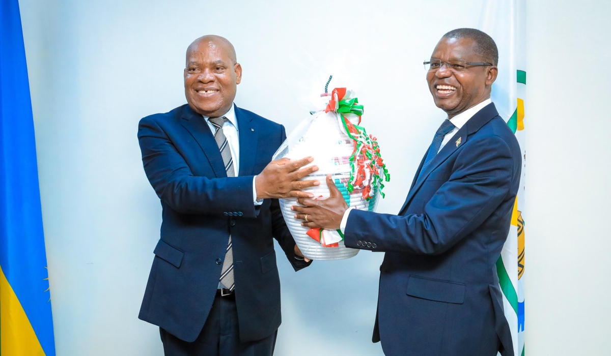 Rwanda&#039;s President of Senate Francois Xavier Kalinda and his Burundian counterpart Emmanuel Sinzoheagera exchange gifts at their meeting in Kigali on Friday, June 20. Courtesy