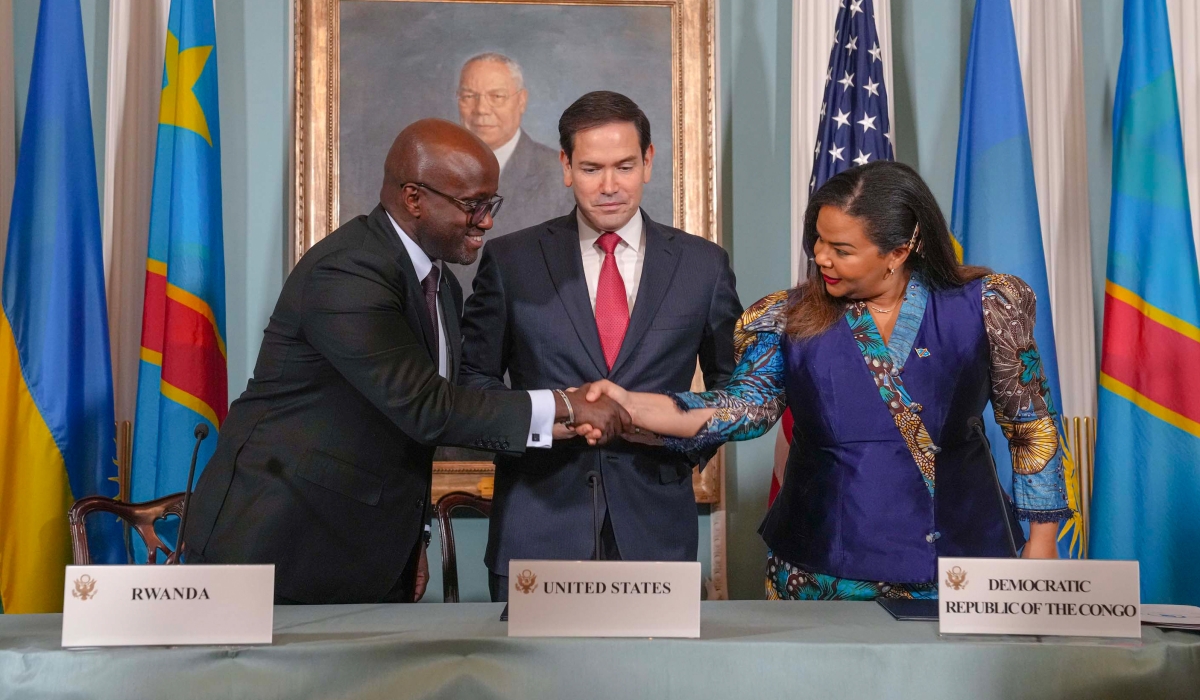 Rwanda&#039;s Minister of Foreign Affairs Olivier Nduhungirehe shakes hands with his DR Congo counterpart Therese Kayikwamba Wagner after signing a peace agreement, as US Secretary of State Marco Rubio looks on in Washington DC, on Friday, June 27. Courtesy