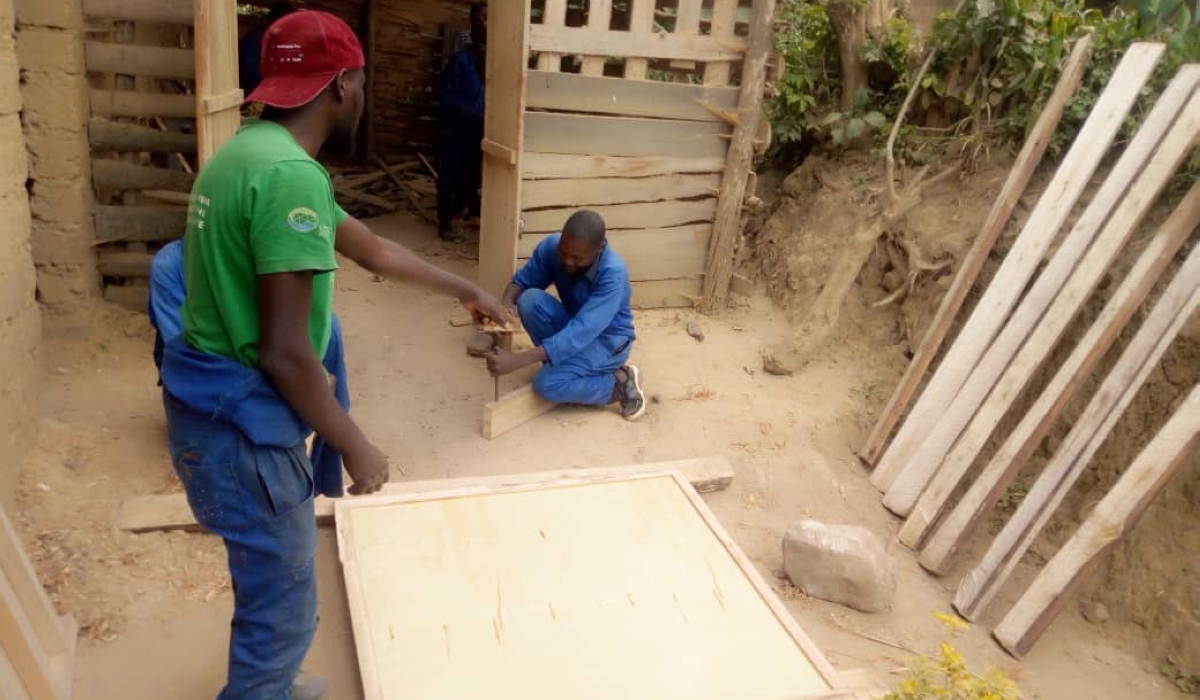 He’s showing one of his workers what to do.