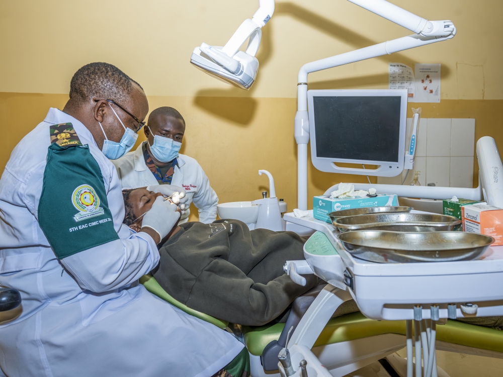 The fifth East African Community (EAC) Armed Forces treat patients during the launch of  Civil-Military Cooperation Week   at Nyanza District Hospital on June 29. Photos by Dan Gatsinzi